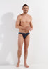 Full-body view of a men model wearing HO navy print modal/viscose/tencel Comfort Micro Briefs