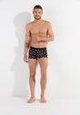 Full-body view of a men model wearing HO black print modal/viscose/tencel Boxer Briefs