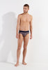 Full-body view of a men model wearing HO navy print cotton Comfort Briefs
