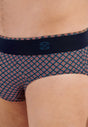 Close-up view of a men model wearing HO navy print cotton Comfort Briefs