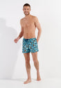 Full-body view of a men model wearing HO blue print  Beach Boxer