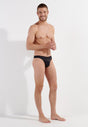 Full-body view of a men model wearing HO black  G-String