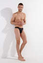 General view of a men model wearing HO black  G-String