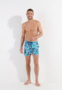 Full-body view of a men model wearing HO blue print  Beach Boxer
