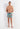 Full-body view of a men model wearing HO turquoise print  Beach Boxer