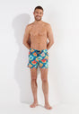 Full-body view of a men model wearing HO turquoise print  Beach Boxer