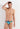 Front view of a men model wearing HO turquoise print  Swim Mini Briefs