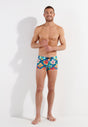 Full-body view of a men model wearing HO turquoise print  Swim Shorts