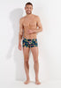 Full-body view of a men model wearing HO navy print  Swim Shorts