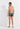 General view of a men model wearing HO navy print  Swim Shorts