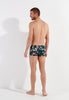 General view of a men model wearing HO navy print  Swim Shorts