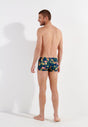 General view of a men model wearing HO navy print  Swim Shorts