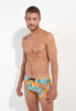 Front view of a men model wearing HO orange print  Swim Shorts