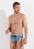 Front view of a men model wearing HO turquoise print  Swim Mini Briefs