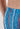 Close-up view of a men model wearing HO turquoise print  Swim Trunk