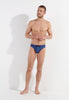 Full-body view of a men model wearing HO navy print  Swim Mini Briefs