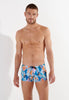 Front view of a men model wearing HO blue print  Swim Shorts