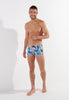 Full-body view of a men model wearing HO blue print  Swim Shorts