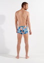 General view of a men model wearing HO blue print  Swim Shorts