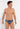 Front view of a men model wearing HO turquoise print  Swim Mini Briefs