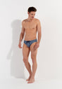 General view of a men model wearing HO turquoise print  Swim Mini Briefs