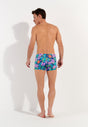 General view of a men model wearing HO navy print  Swim Shorts