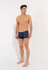 Full-body view of a men model wearing HO black print  Trunk