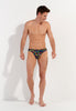 Full-body view of a men model wearing HO multico print  Comfort Micro Briefs