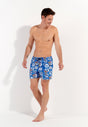 Full-body view of a men model wearing HO blue print  Beach Boxer