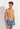 Front view of a men model wearing HO blue print  Swim Shorts