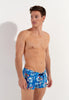 Front view of a men model wearing HO blue print  Swim Shorts