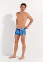 Full-body view of a men model wearing HO blue print  Swim Shorts