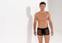 General view of a men model wearing HO black  Trunk
