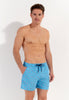 Front view of a men model wearing HO turquoise print  Beach Boxer