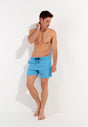 Full-body view of a men model wearing HO turquoise print  Beach Boxer