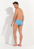 General view of a men model wearing HO turquoise print  Swim Mini Briefs