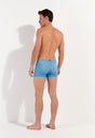 General view of a men model wearing HO turquoise print  Swim Shorts