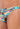 Close-up view of a men model wearing HO orange print  G-String