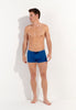 Full-body view of a men model wearing HO blue print  Swim Shorts