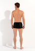 General view of a men model wearing HO black  Swim Shorts