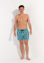 Full-body view of a men model wearing HO blue print  Beach Boxer