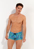 Front view of a men model wearing HO blue print  Swim Shorts