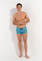Full-body view of a men model wearing HO blue print  Swim Shorts