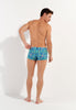 General view of a men model wearing HO blue print  Swim Shorts