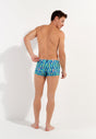 General view of a men model wearing HO blue print  Swim Shorts