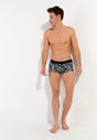 Full-body view of a men model wearing HO dark grey print  Trunk