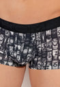 Close-up view of a men model wearing HO dark grey print  Trunk