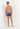 Full-body view of a men model wearing HO navy print  Swim Shorts