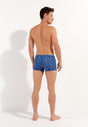 General view of a men model wearing HO navy print  Swim Shorts