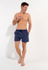 Full-body view of a men model wearing HO navy print  Beach Boxer